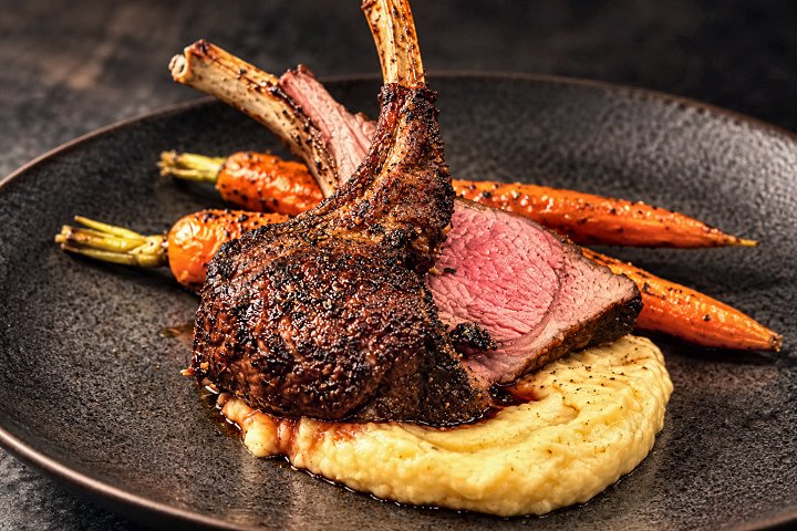 Herb-crusted rack of halal lamb with polenta and glazed carrots by Chef Fassi