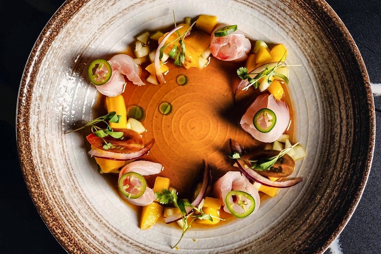 Red snapper ceviche with mango, radish and serrano, plated by Chef Martin Fassi in Houston