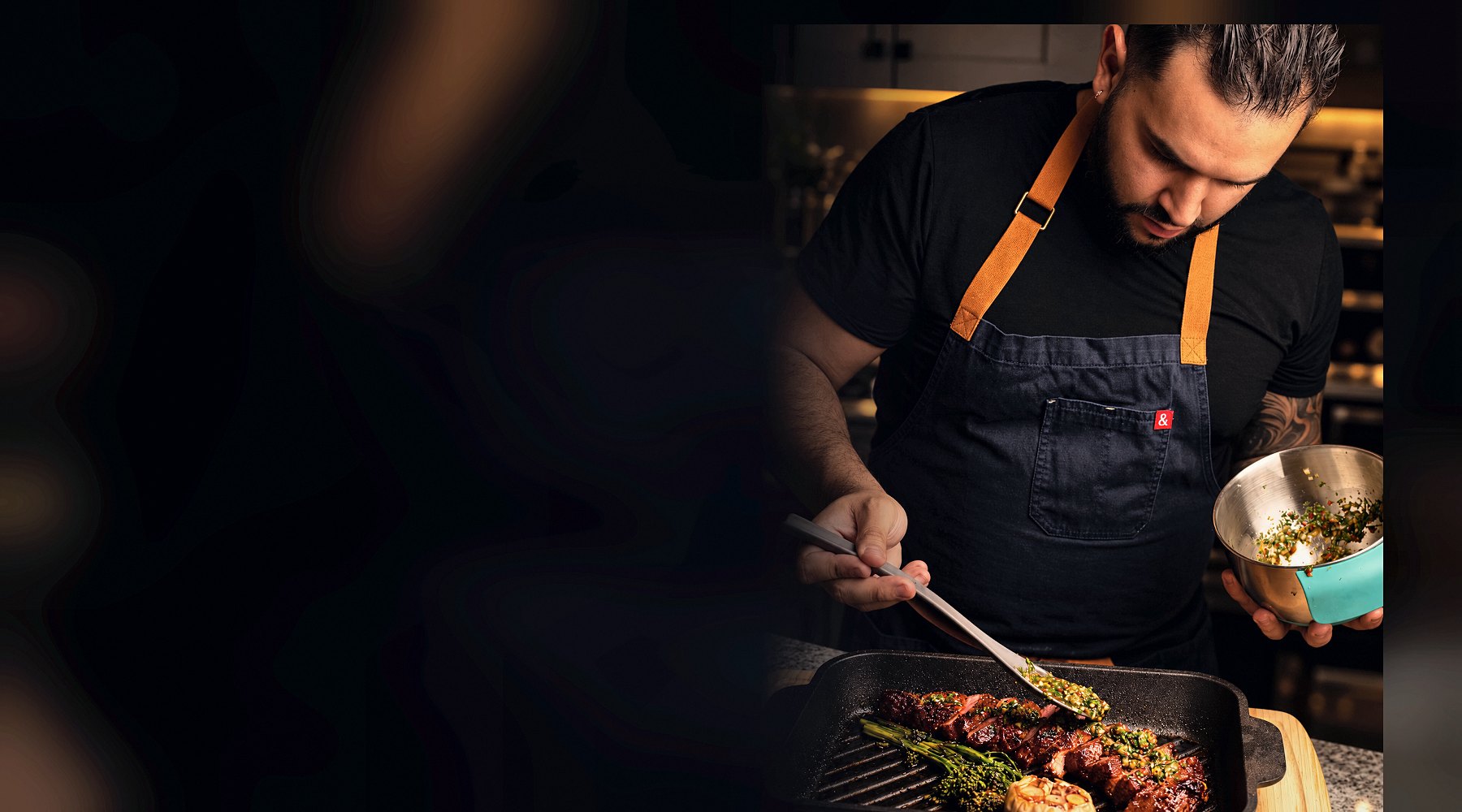 Chef Martin Fassi plating a course in a private Houston dining room