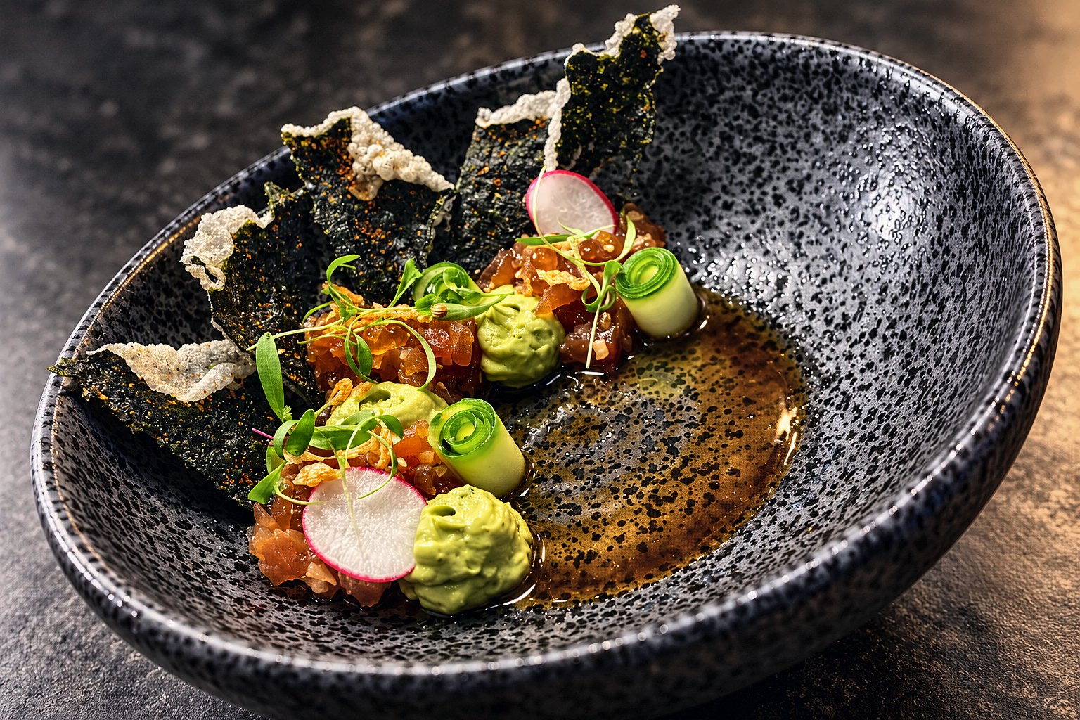 Tuna tartare with crisps and avocado, plated by Chef Fassi in Downtown Houston