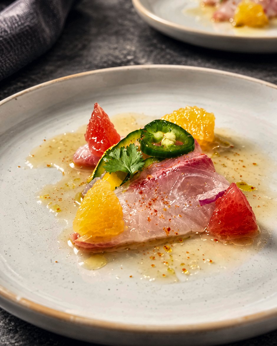 Citrus-cured crudo with grapefruit and jalapeño, plated for a Houston wedding by Chef Fassi